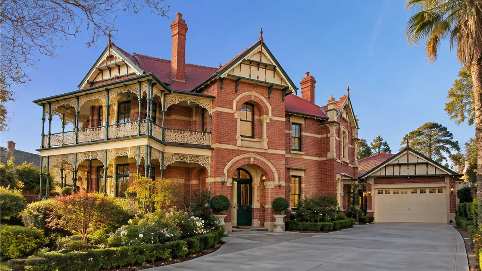 Residential concrete driveway curving past a red-brick Victorian home in Bendigo